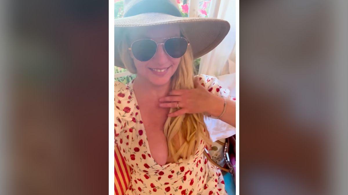 Photo of Britney Spears added a sun hat and sunglasses to complete the daytime look.