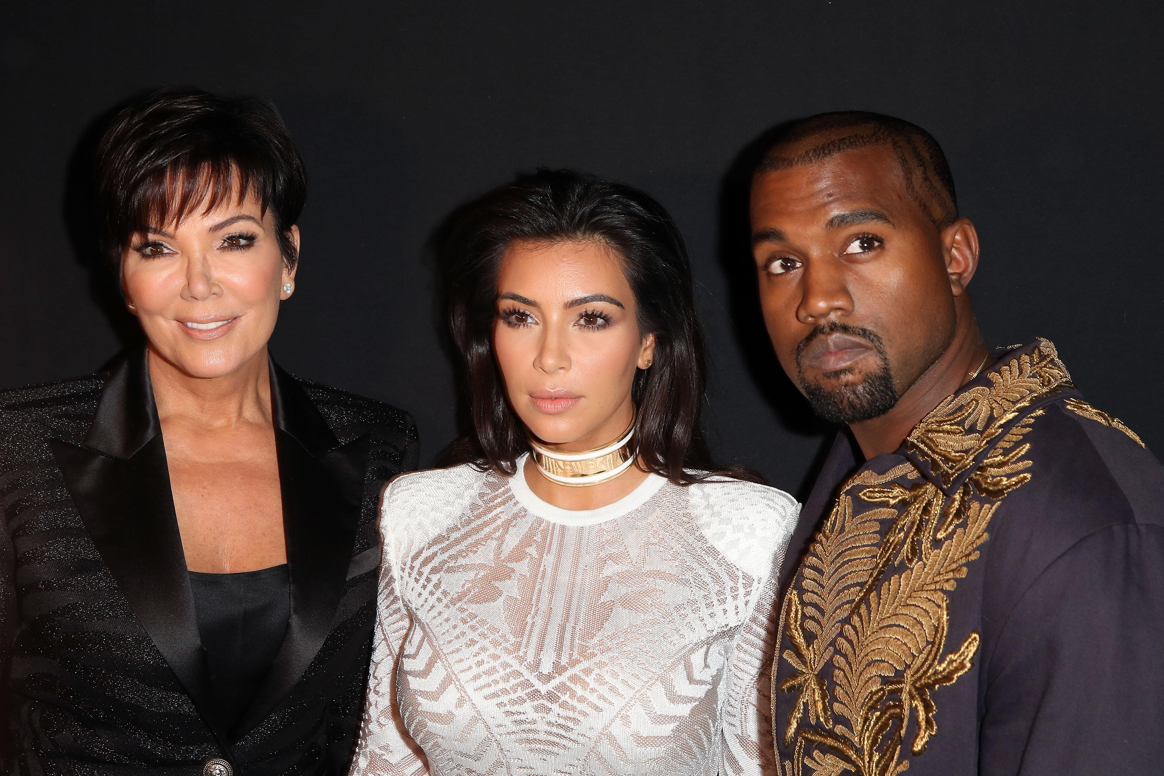 Kim Kardashian and Kanye West attend the Balmain show