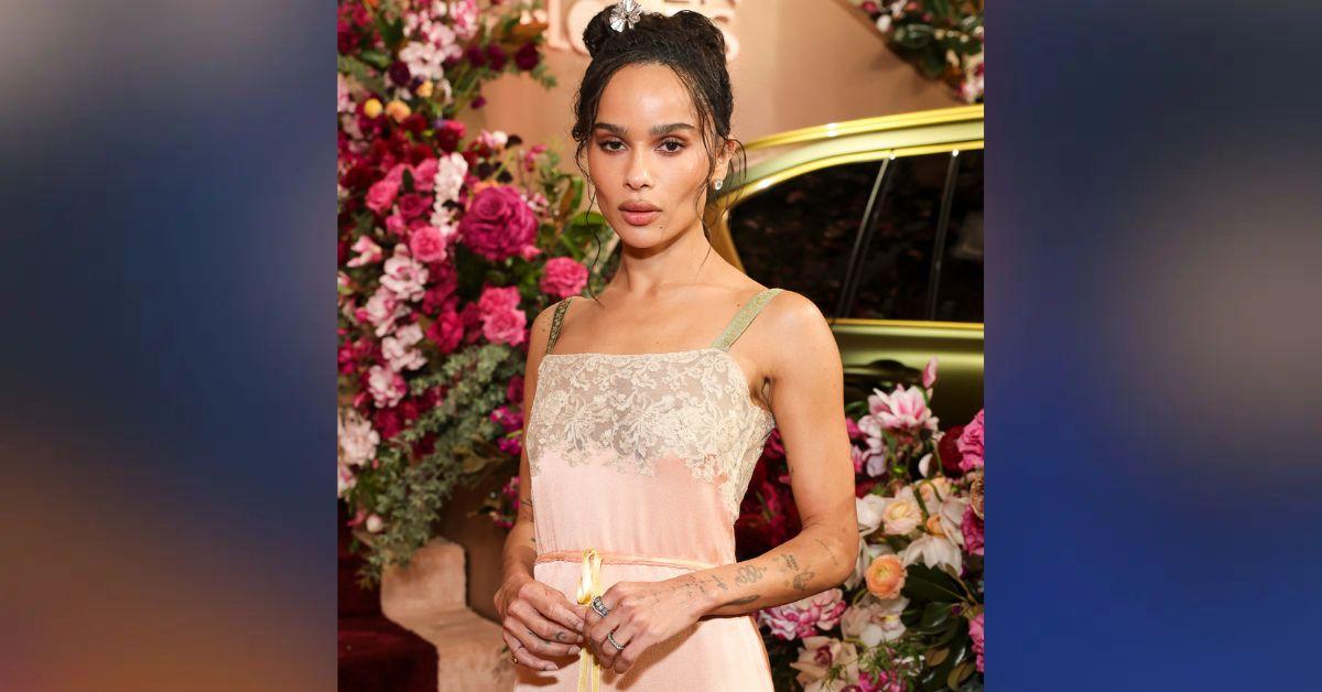 Photo of Zoë Kravitz sported a pink maxi dress with a lace trimmed neckline. 