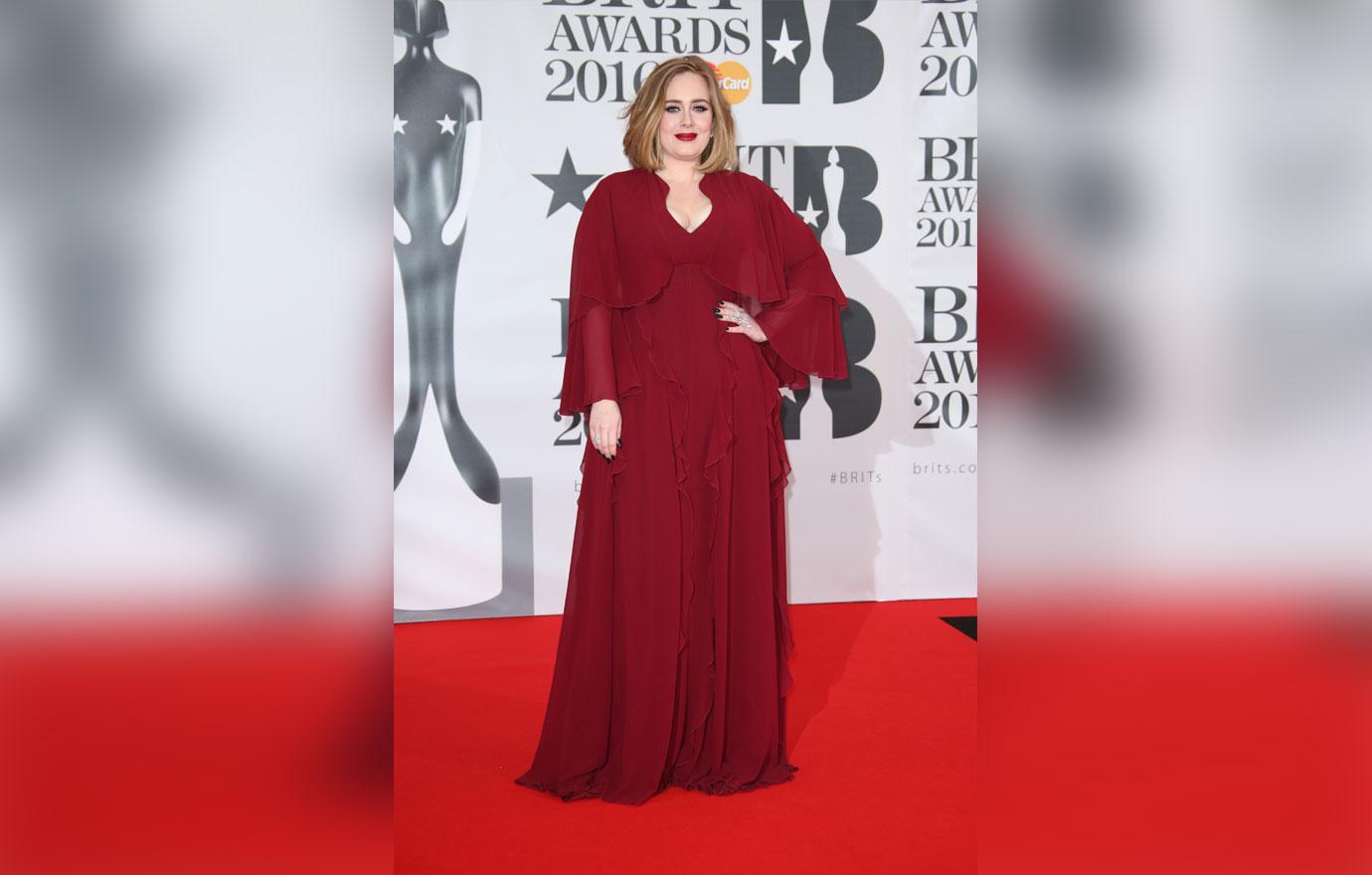 Singer Adele poses for photographers upon arrival for the Brit Awards 2016 at the 02 Arena in London