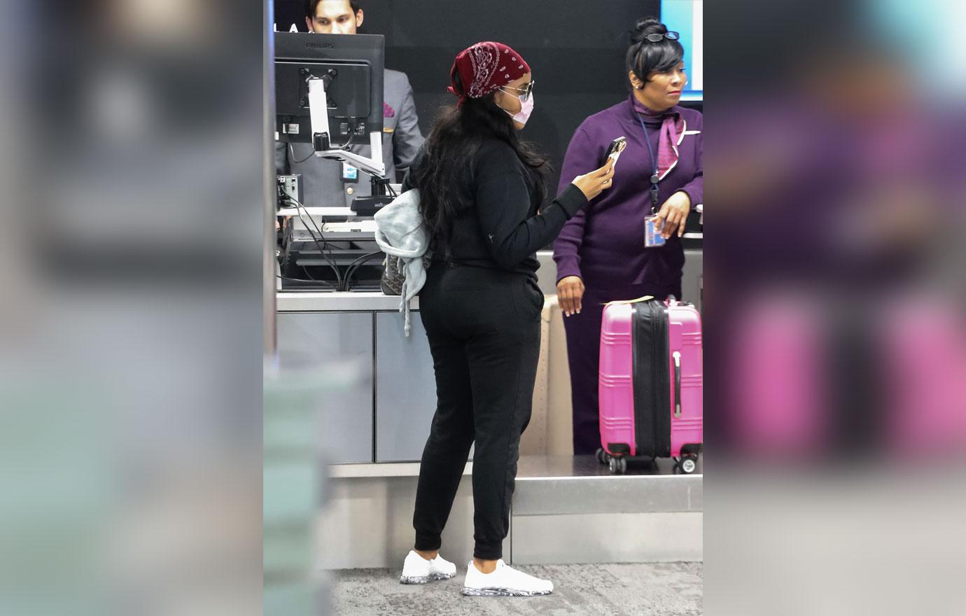 Angela Simmons Wears Face Mask At Airport Amid Coronavirus Outbreak