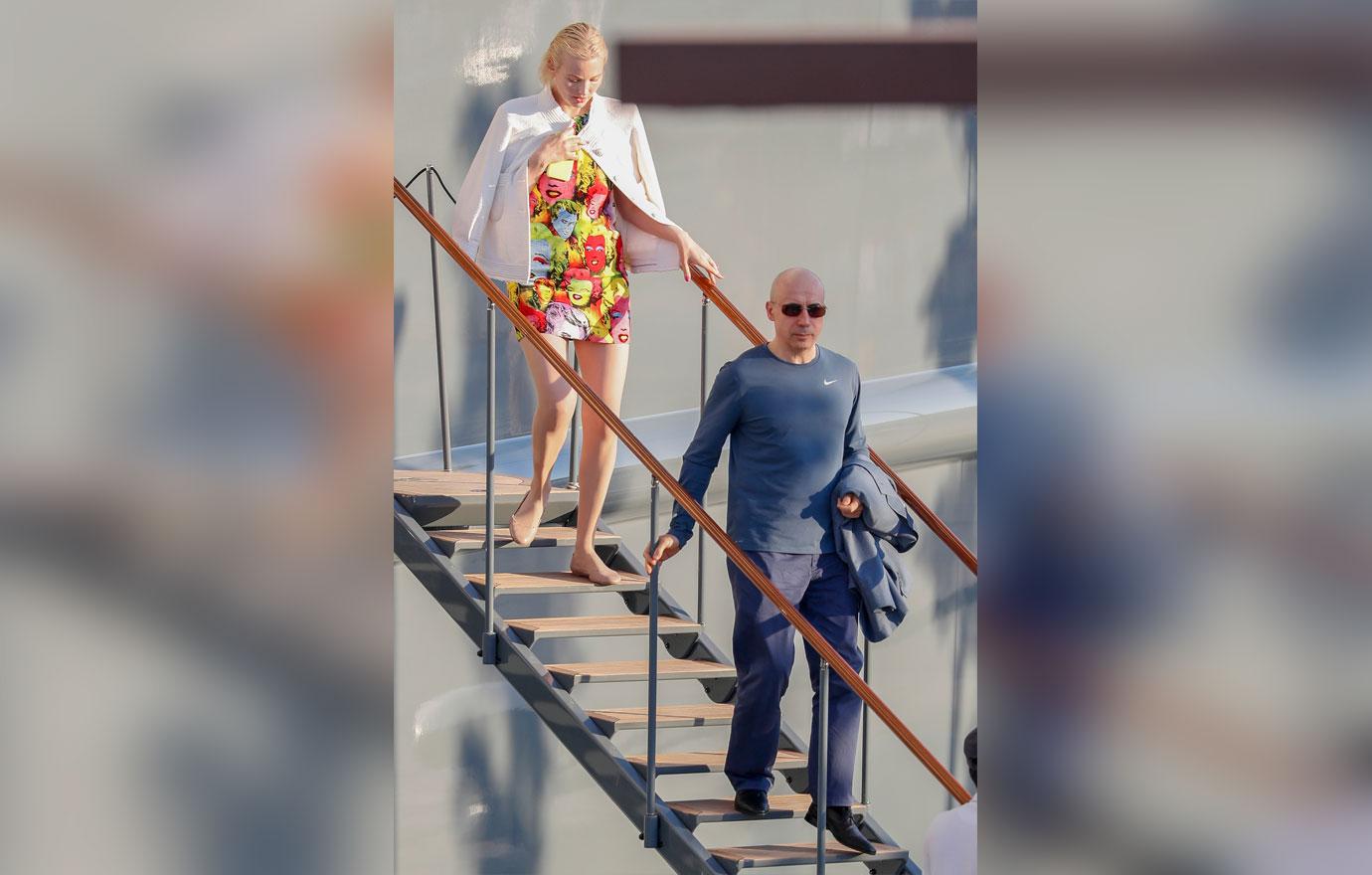 EXCLUSIVE: Christina Aguilera and Karolina Kurkova arriving at a port in Ibiza to board a yacht