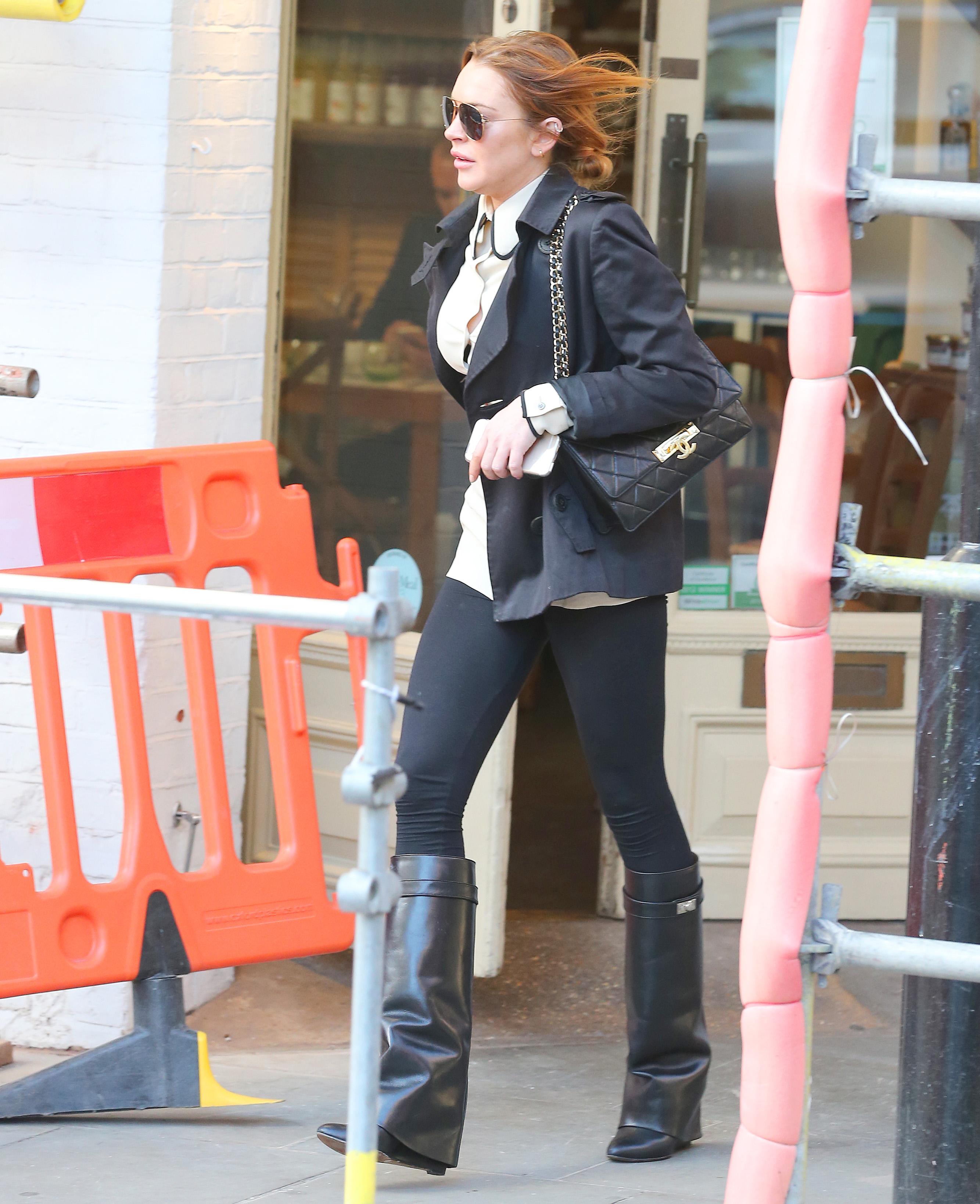 EXCLUSIVE: Lindsay Lohan seen out and about in London before going to the playhouse for her performance