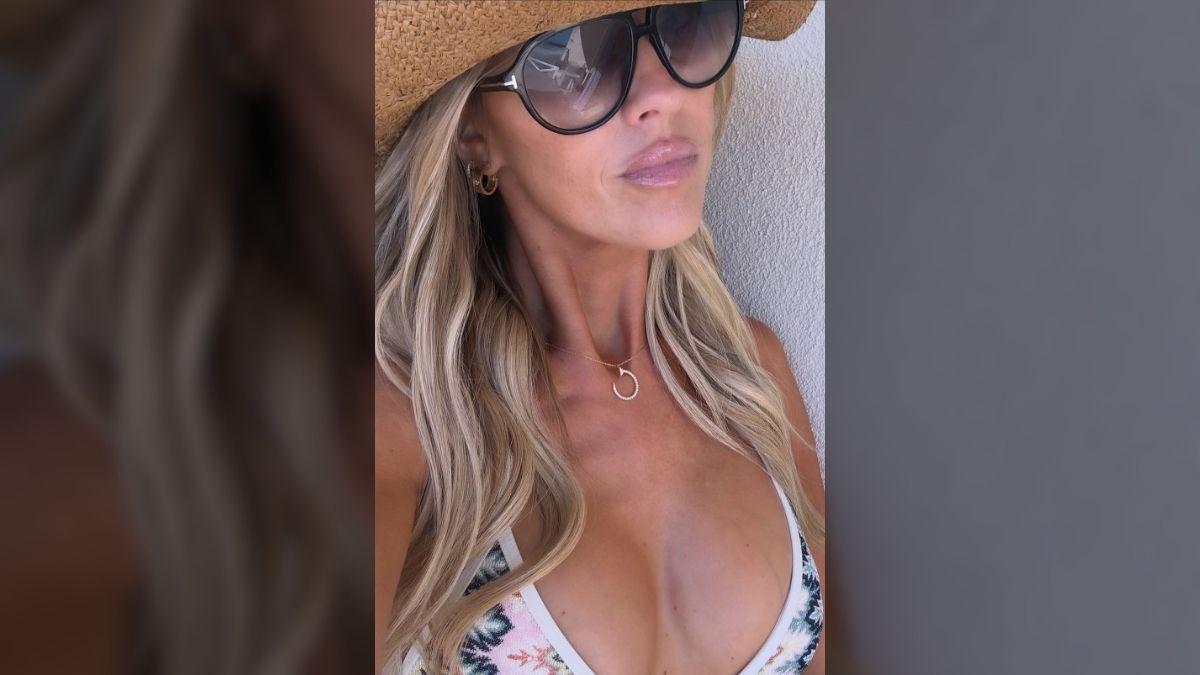Photo of Christina Haack opted for a white bikini with a colorful graphic print.