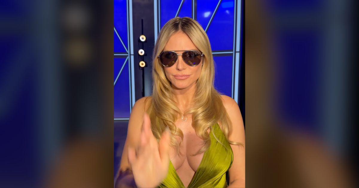 Image of Heidi Klum popped out of a racy green dress.