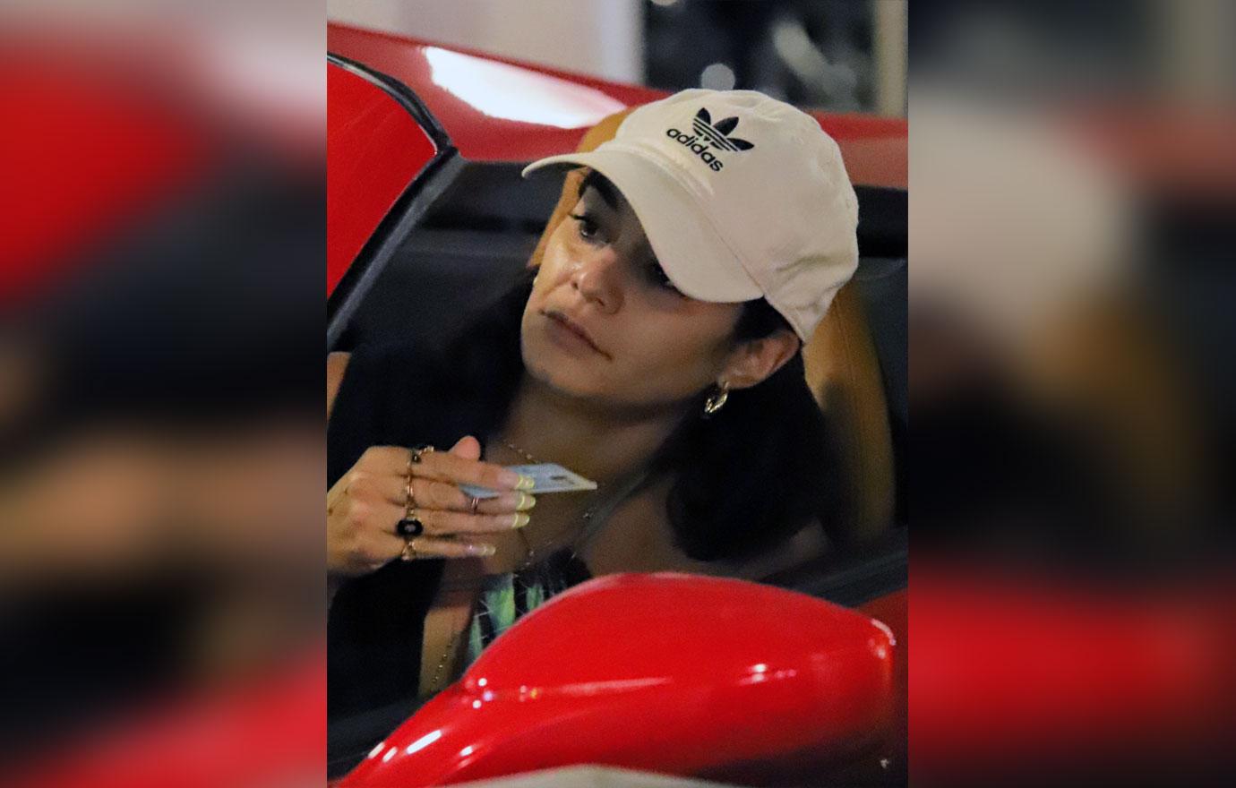 Vanessa Hudgens stuffs her Ferrari after early holiday shopping at the mall.