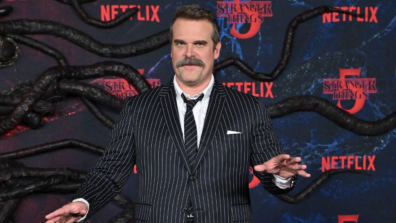 Image of David Harbour reflected on his time with Millie Bobby Brown on 'Stranger Things' and discussed the impact of their characters’ relationship on fans.