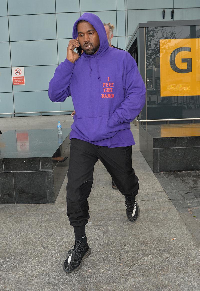 Kanye West arriving at Heathrow airport.