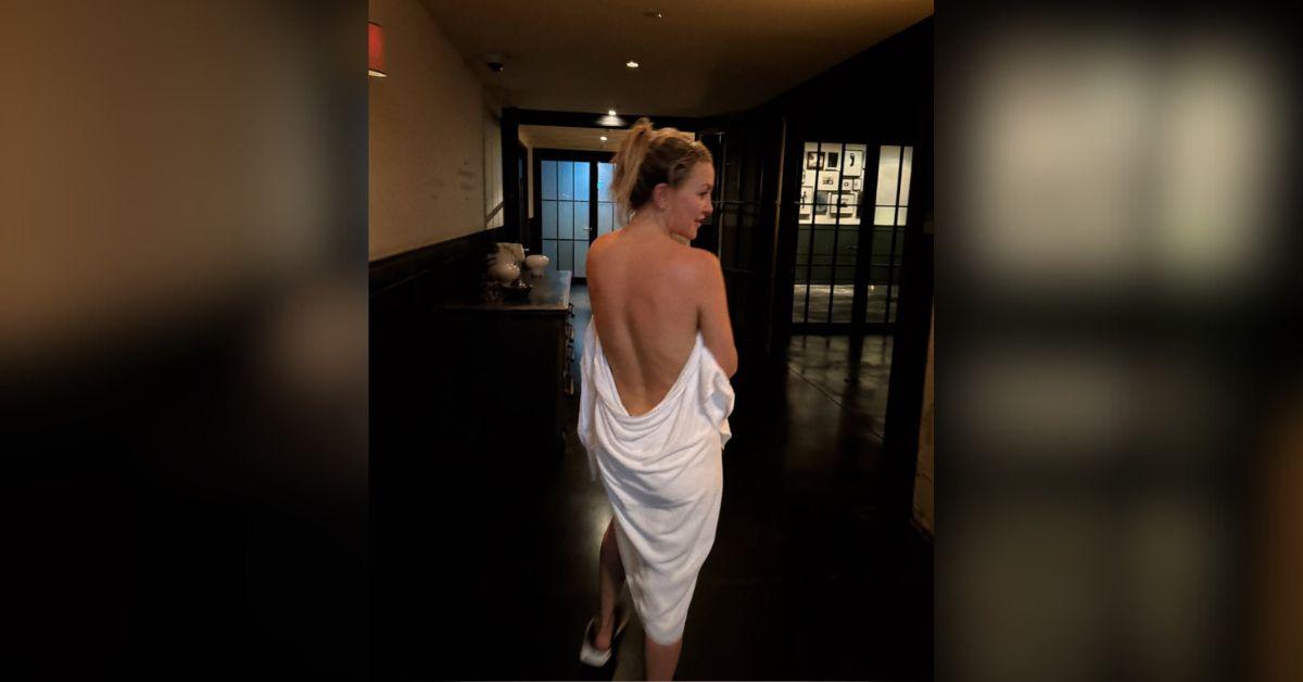 image of Kate Hudson stripped down nothing but a towel while in Berlin, Germany.