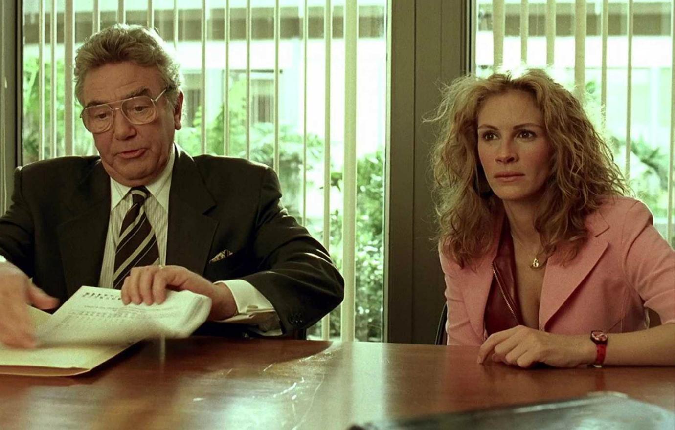 Albert Finney sported a brown suit while Julie Roberts sat next to him in a pink business suit in Erin Brockovich.