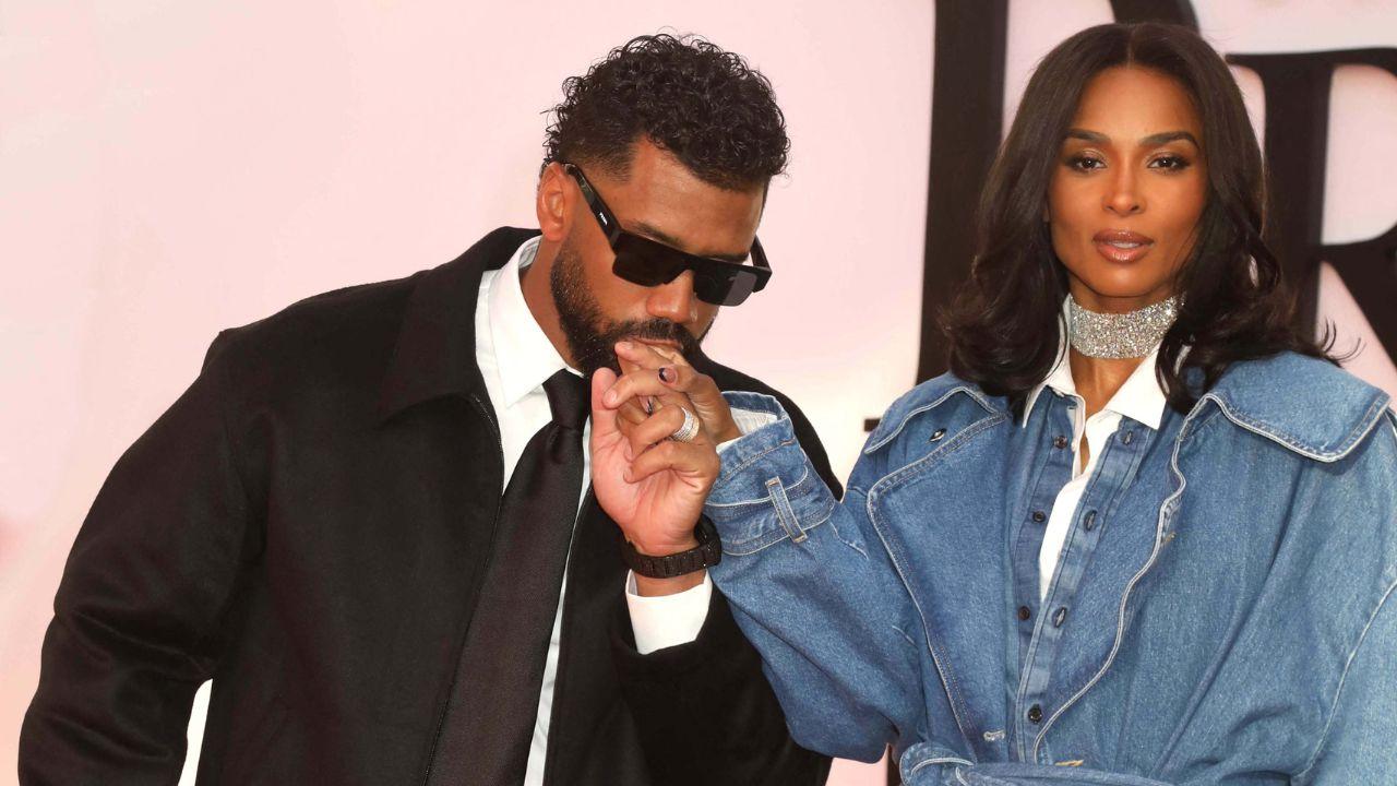 Image of Russell Wilson and Ciara announced their pregnancy through a carousel of photos and videos featuring them hanging around white T-shirts on a clothesline representing each member of their family.