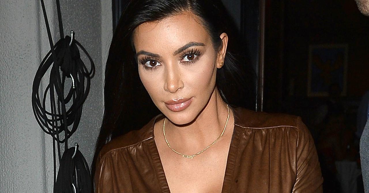 Watch Kim Kardashian Exit Dinner In Cleavage-Baring Outfit