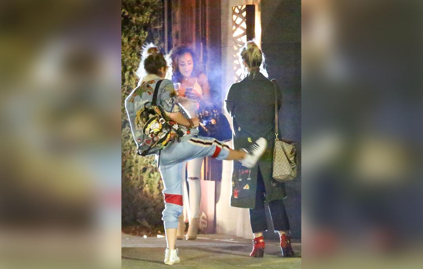 *EXCLUSIVE* Paris Jackson kicks her friend in the butt on the way out of Nobu in Malibu