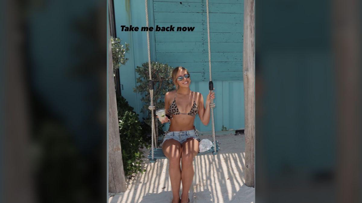 Photo of Tate McRae rocked mini denim shorts during the beach trip.