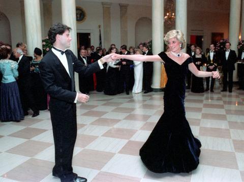 prince harry accused wearing heels towers over john travolta photo