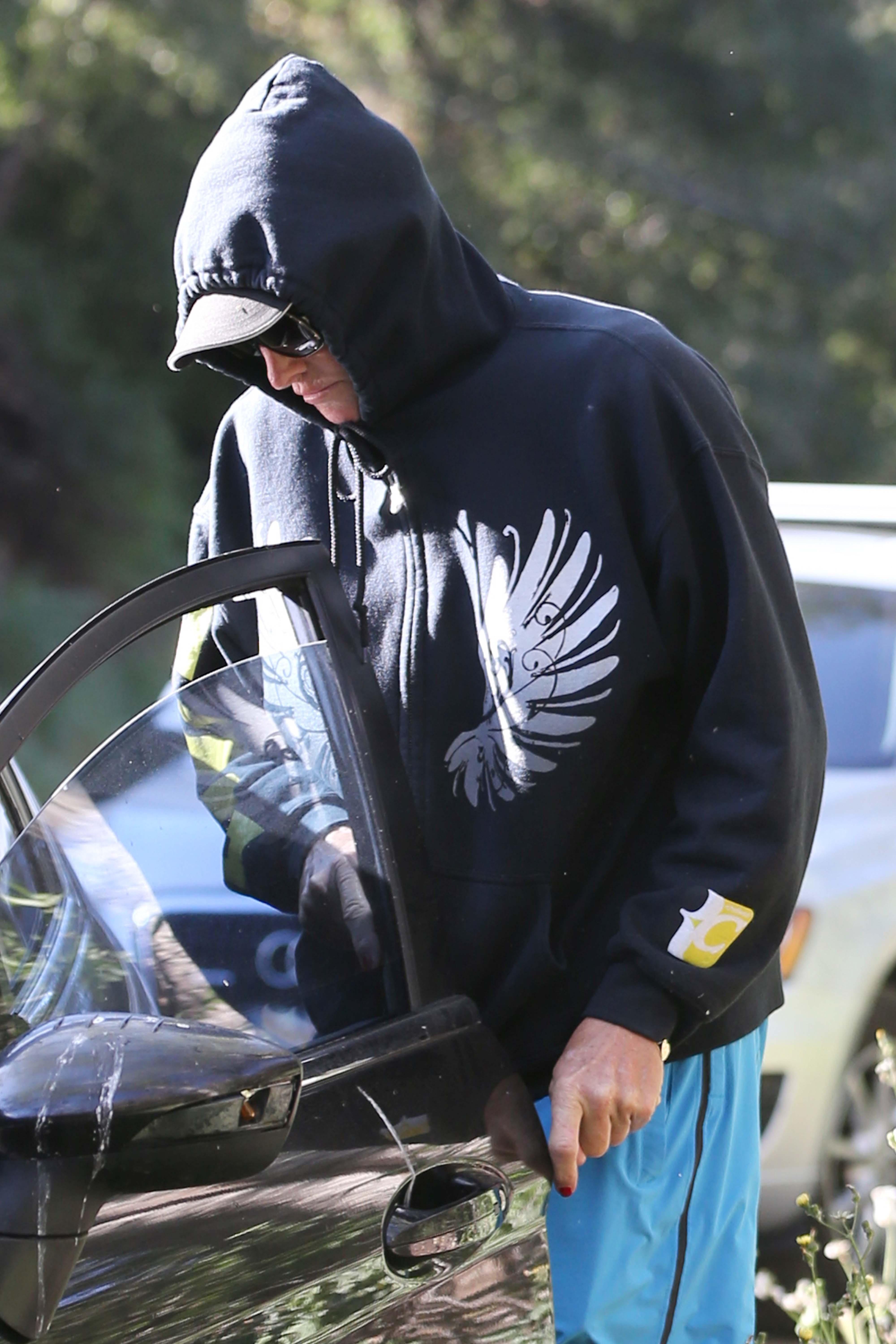 Bruce Jenner wearing red nail polish takes an early morning hike in Malibu