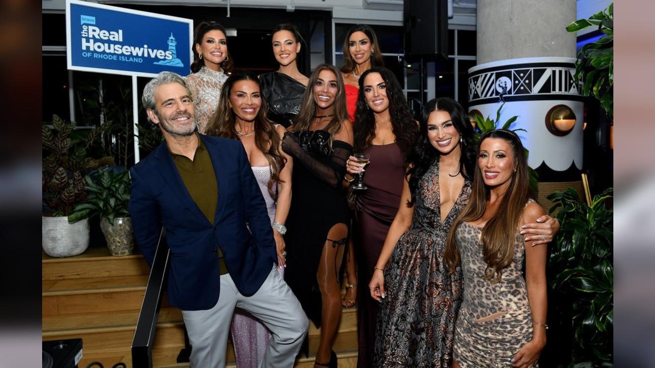 Photo of Andy Cohen and 'The Real Housewives of Rhode Island.' 