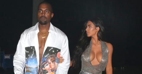 EXCLUSIVE: Kim Kardashian shows off her curves as she holds Kanye West as they get close and walk together backstage at the American Airlines arena in Miami
