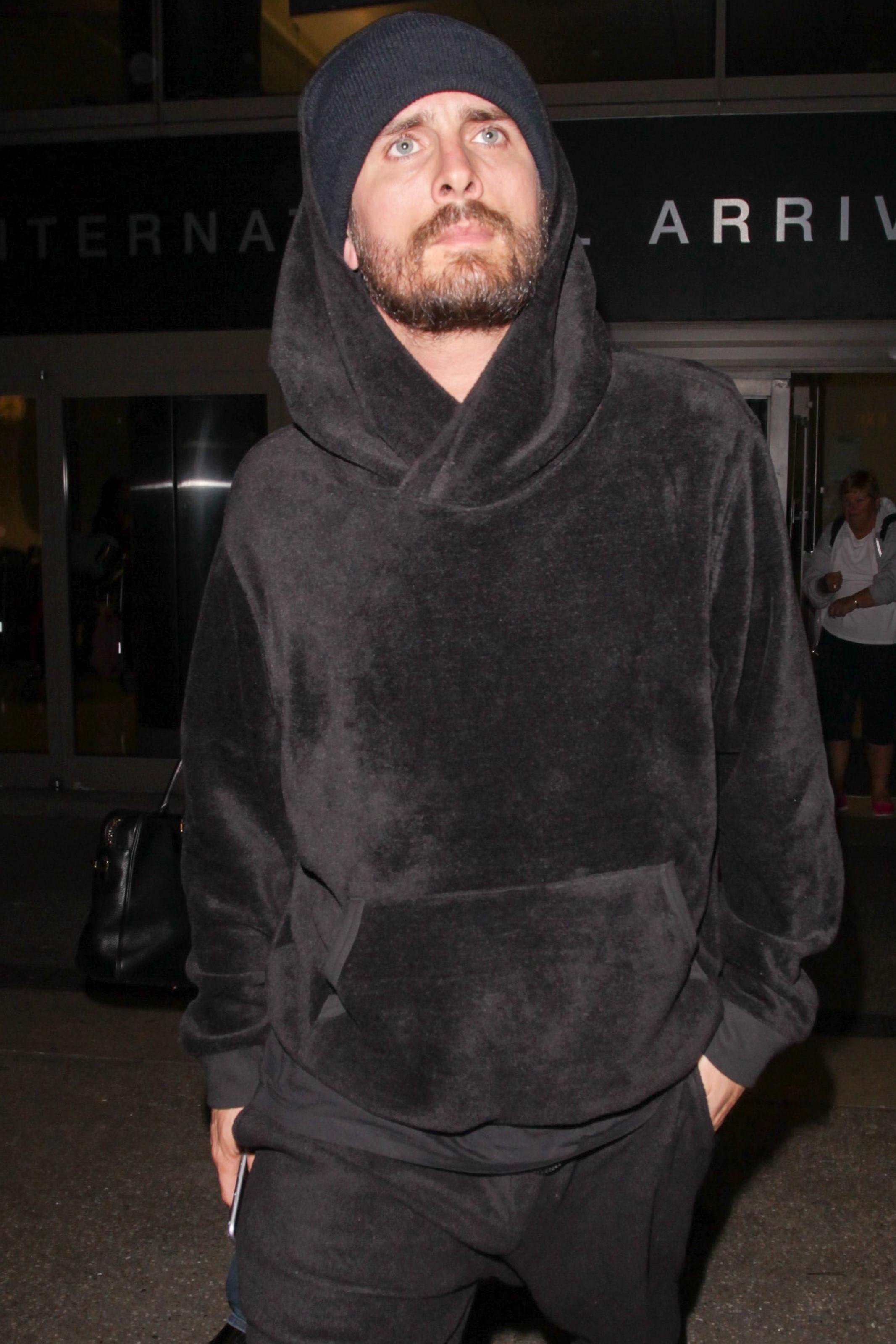 Scott Disick arrives back in LA after a quick trip with Kim to Dubai