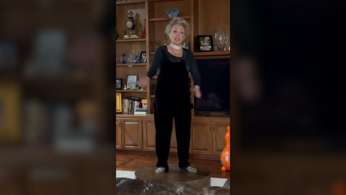 image of Barr paired velvet overalls with a sparkling choker and bold eyeliner.