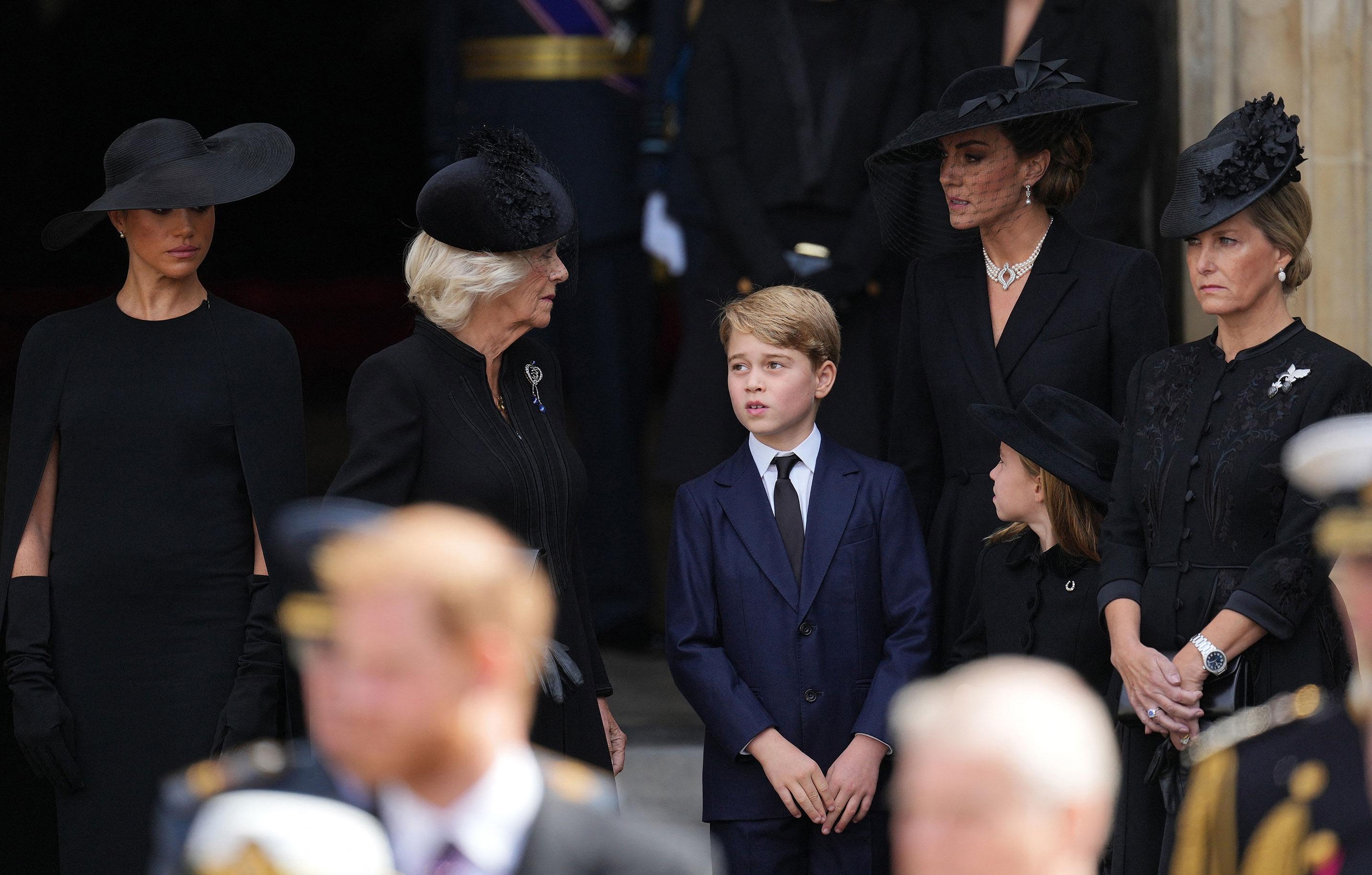 meghan markle standing slightly away from royal family at queens funeral signals a possible emotional distance