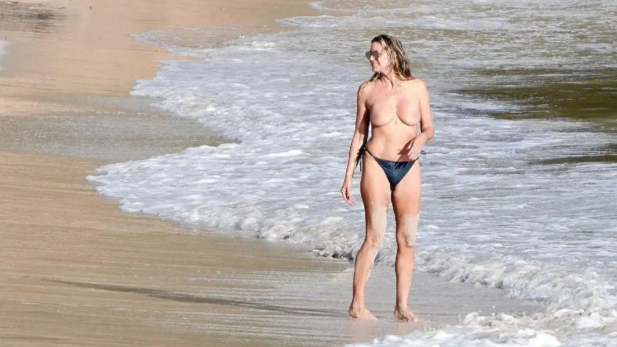 image of Heidi Klum tends to go topless while on vacation. 