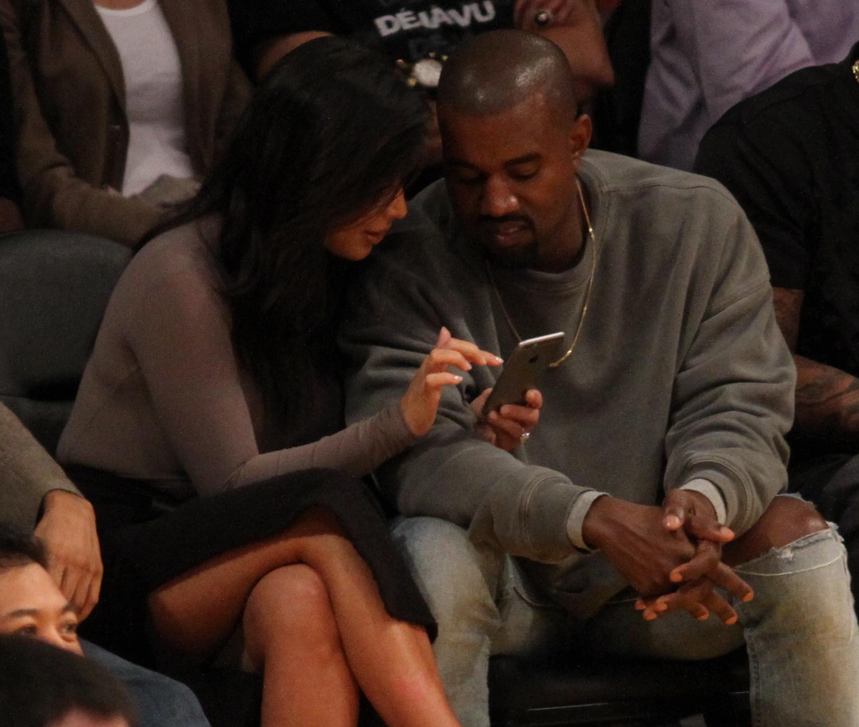 Kim Kardashian West and her husband Rappr Kanye West attend the Los Angeles Lakers season opener against the Houston Rockets at the Staples Center in Los Angeles, CA