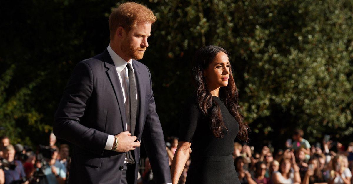 prince harry and meghan markle looking sad