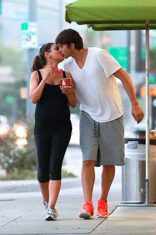 *EXCLUSIVE* Ashton and Mila feed her cravings with a Frozen Yogurt and a Kiss