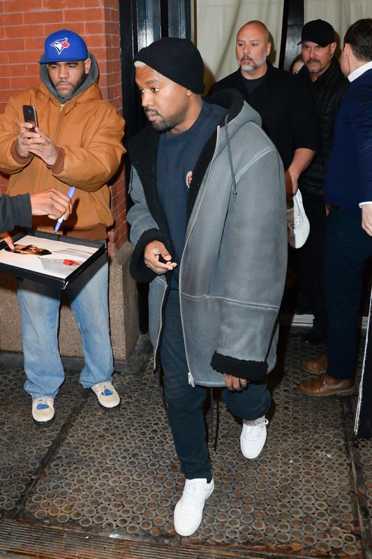 Kanye West steps out of his apartment before his fashion show starts