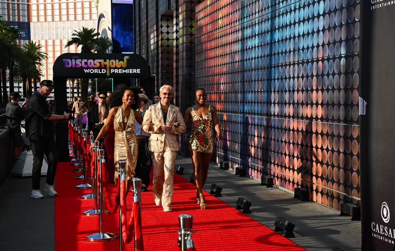 the cast of discoshow arrives on the red carpet for the world premiere sept   a brenton ho spiegelworld