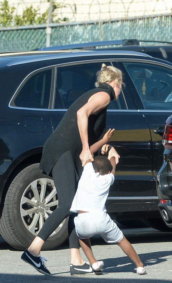 Child drags charlize theron A Young