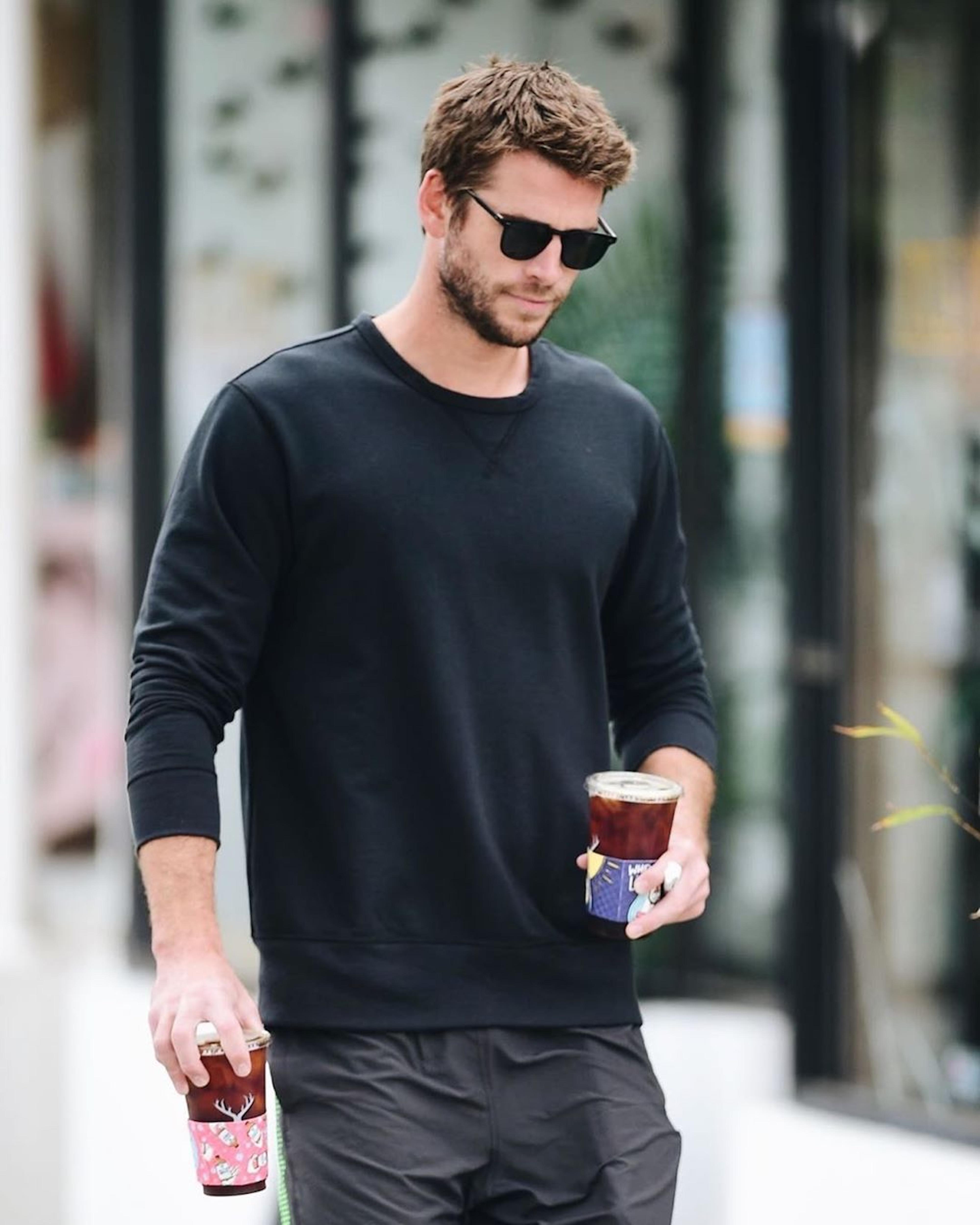 Liam Hemsworth Spotted Holding Health-Ade x Alfred's Partnership Coffee Sleeve