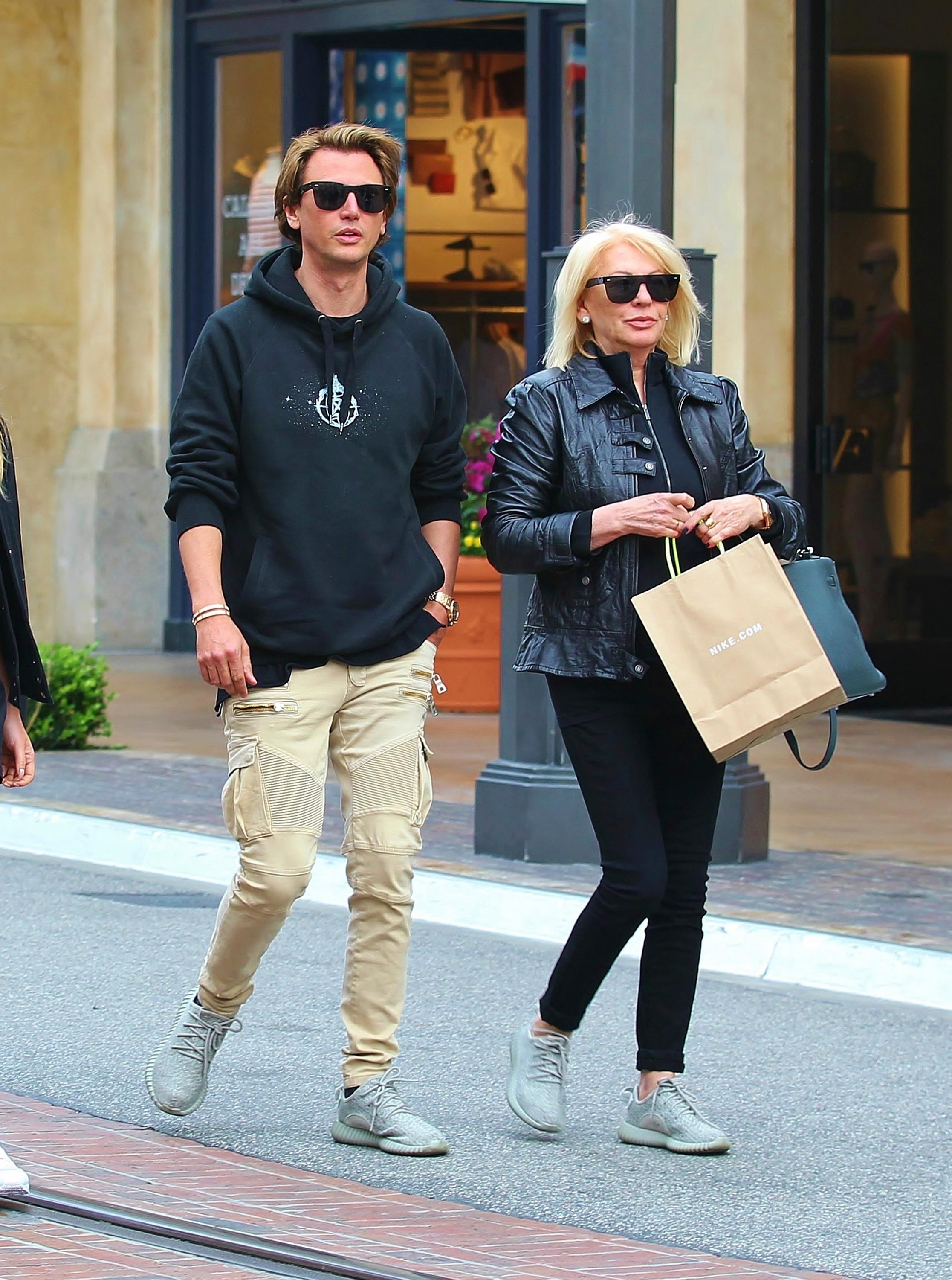 EXCLUSIVE: Jonathan Cheban and his mother wearing Adidas Yeezy 350 Boost whilst shopping at Nike Store in West Hollywood, California