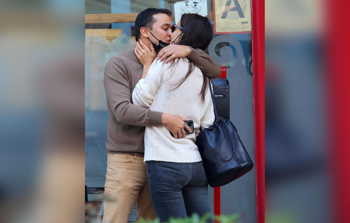 Katie Holmes and boyfriend Emilio Vitolo Jr. are all smiles as they continue another steamy make-out session outside his restaurant in NYC