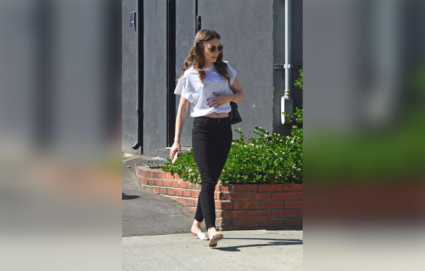 EXCLUSIVE: Lily Collins keeps it casual in black jeans and a white t shirt as she is spotted running errands