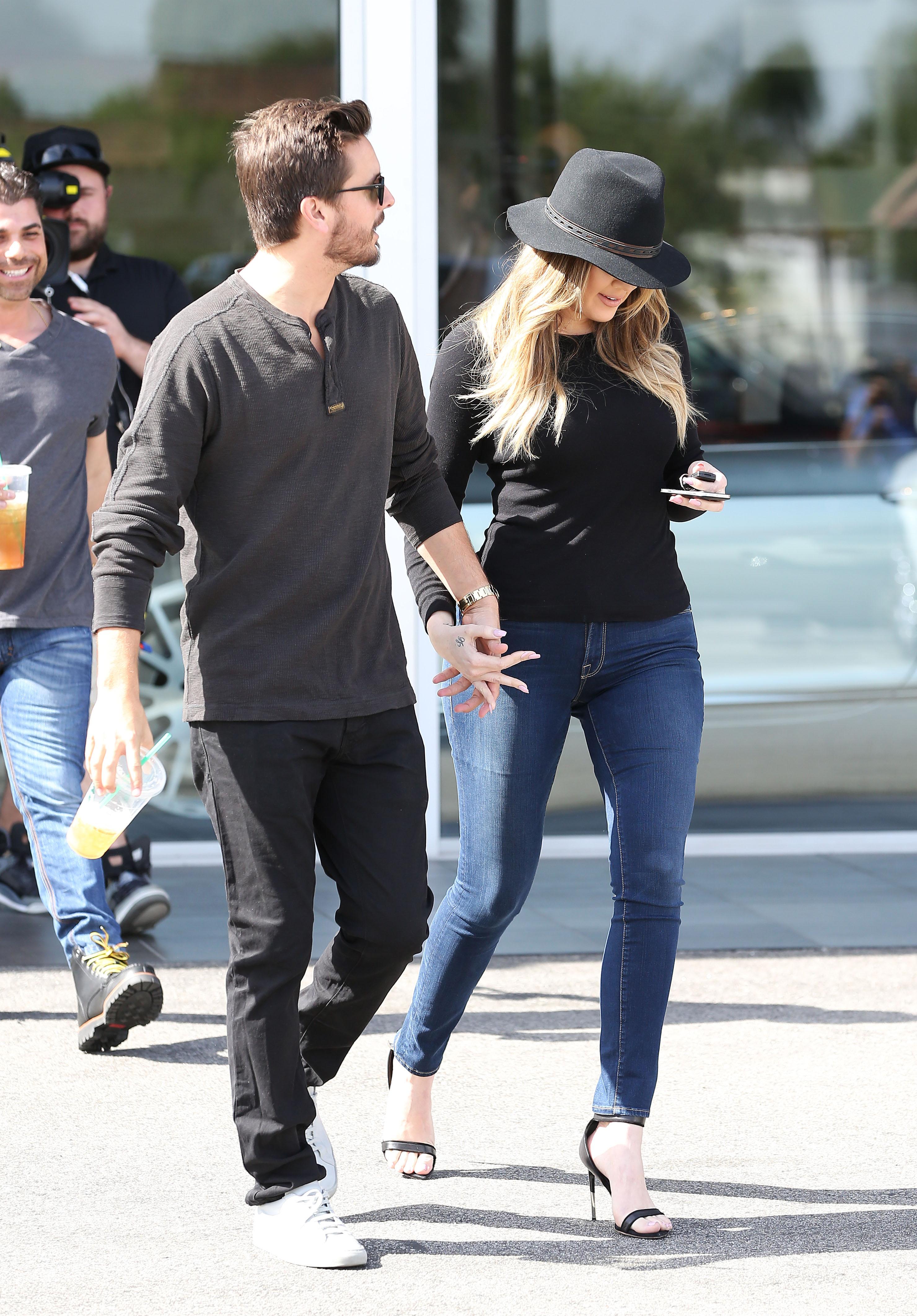 Khloe Kardashian holding hands with Scott Disick as they film &#039;Keeping up with the Kardashians