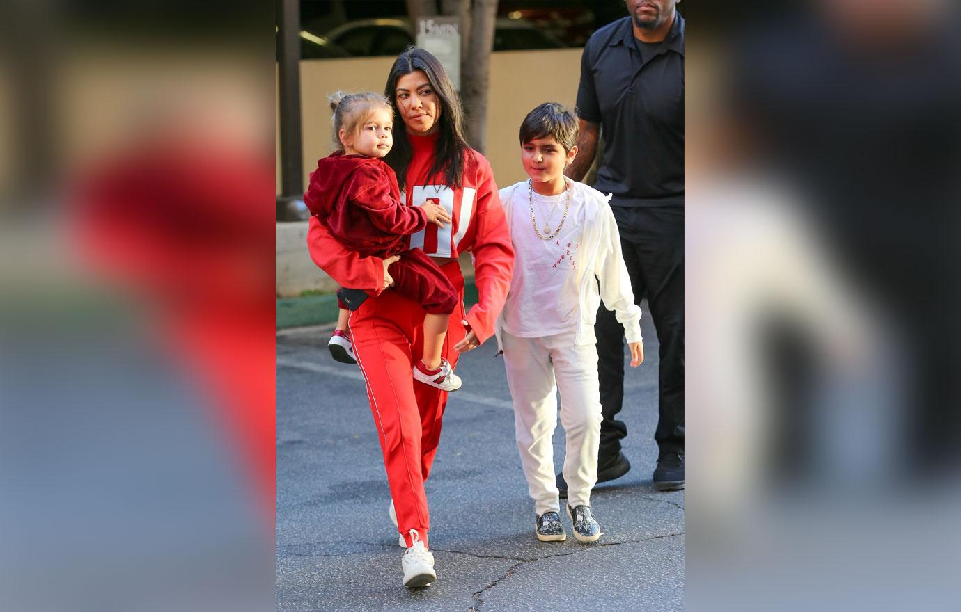 Kourtney Kardashian carries Reign Disick to Mason&#8217;s art class in Calabasas