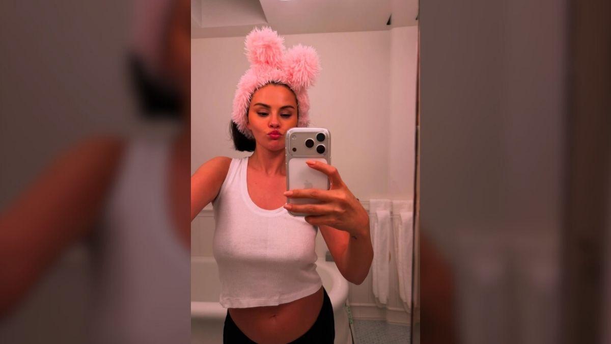 Photo of Selena Gomez stripped down into a tiny white tank top.