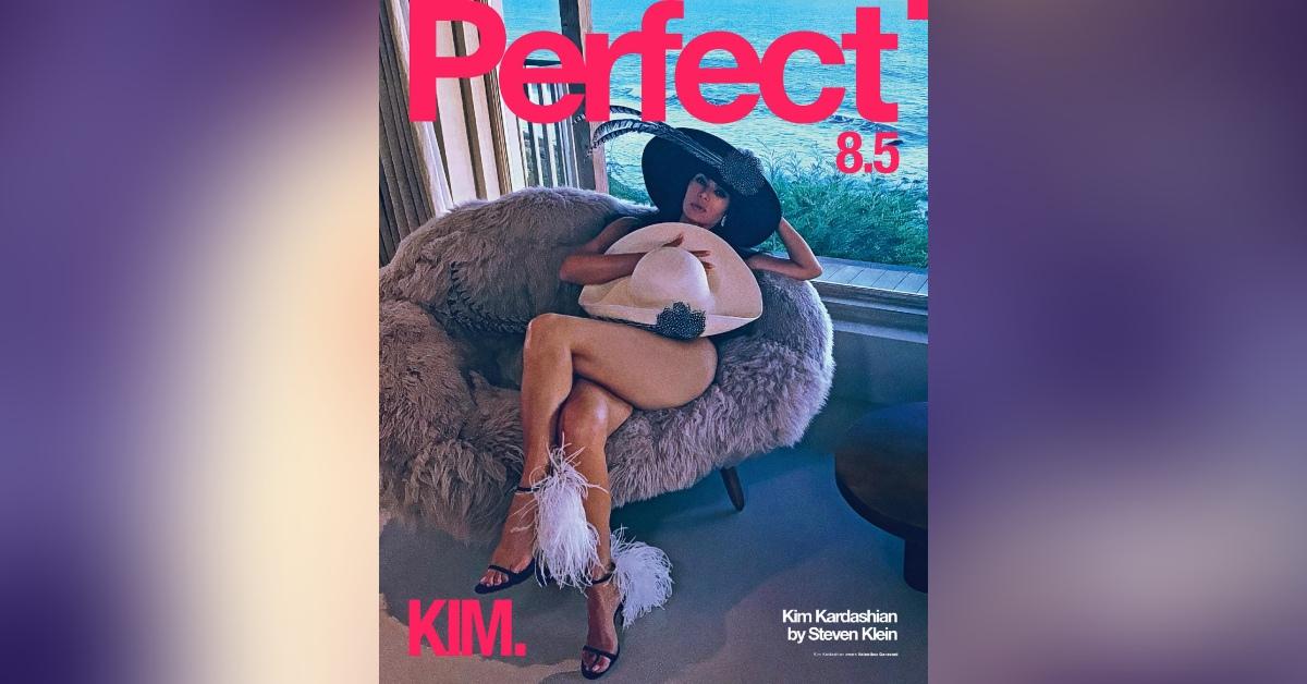 kim kardashian covers body oversized hat risque photoshoot