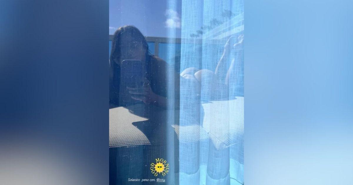 image of The actress relaxed by the water in the sun.