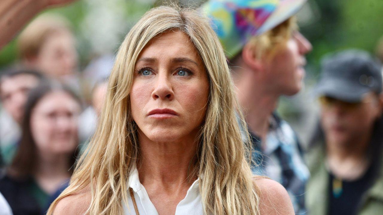 image of Jennifer Aniston joined Jim Curtis at a New York event.