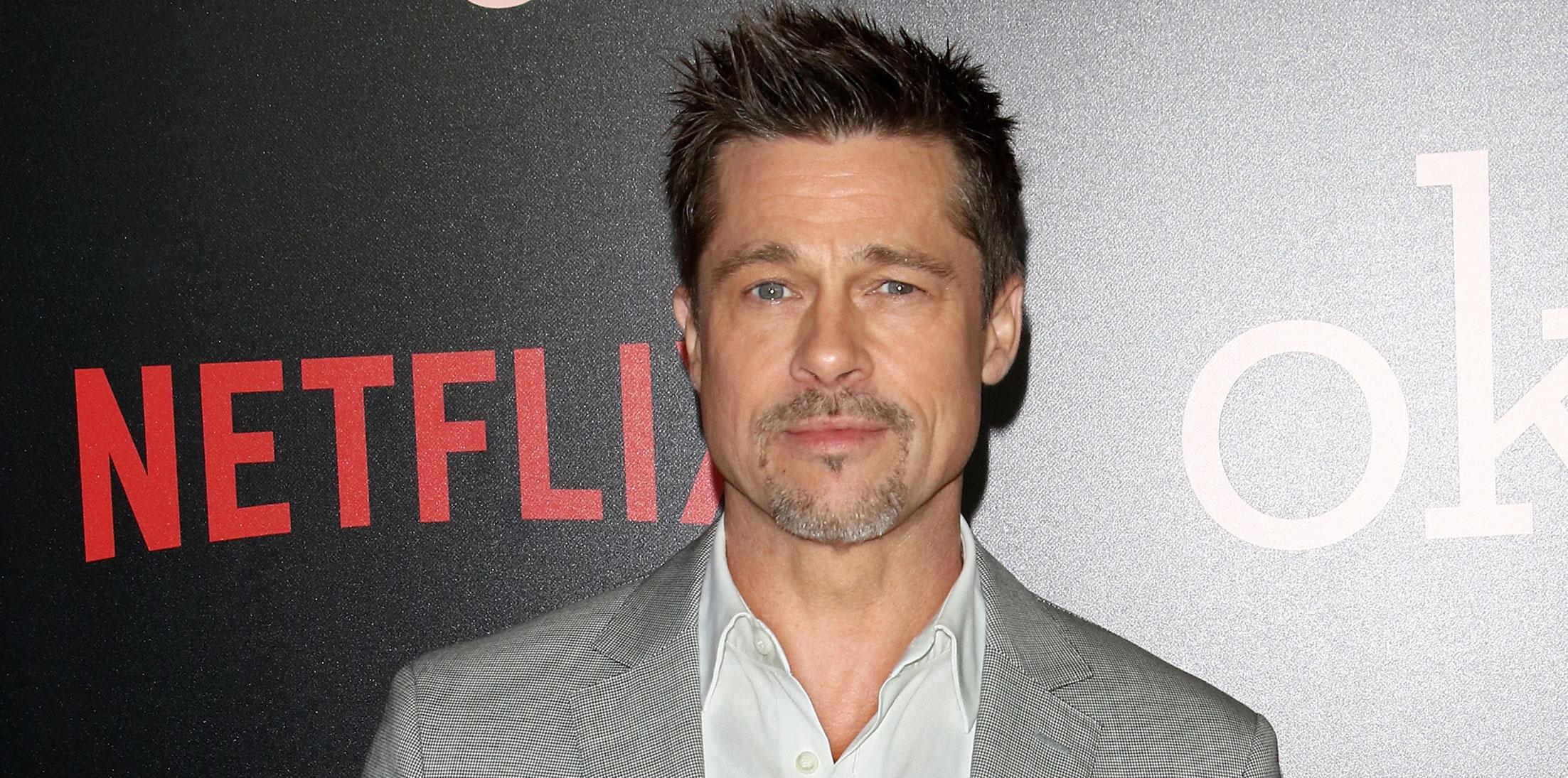 Brad pitt sienna miller spotted holding hands uk music festival