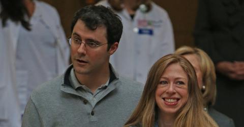 Chelsea Clinton, Marc Mezvinsky and newborn Charlotte step out of Lenox Hill Hospital in New York City