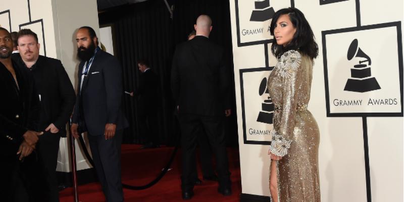 Kim Kardashian butt view at Grammys in a gold dress