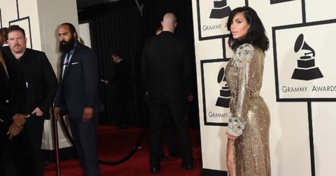 Kim Kardashian butt view at Grammys in a gold dress