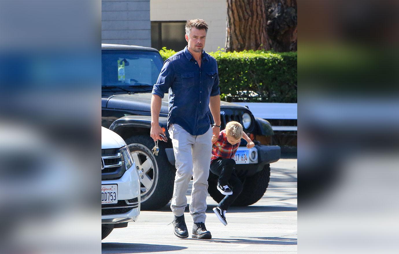 Josh duhamel shows off washboard abs with son 6