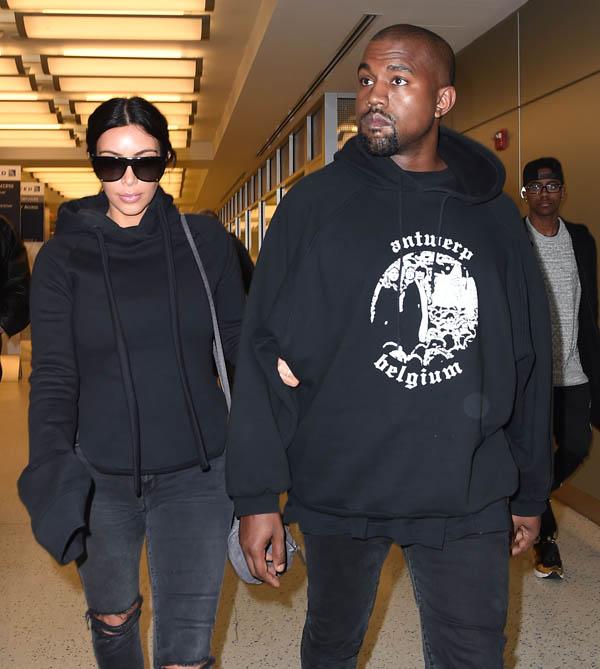 Kim Kardashian and Kanye West arrive at JFK airport in NYC.