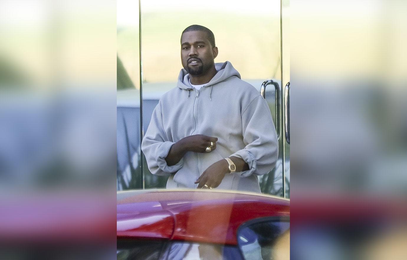 *EXCLUSIVE* Kanye West shows off his gold bling while out running errands