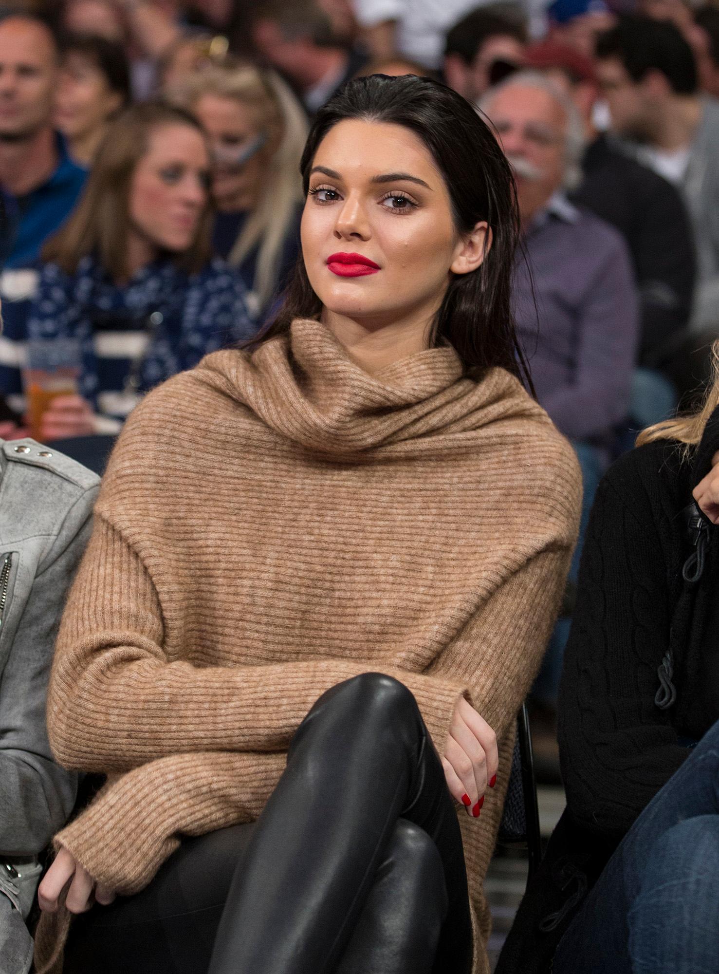 Kendall Jenner sits court side during NY Knicks game at Madison Square Garden with with Hailey Baldwin and Gigi Hadid